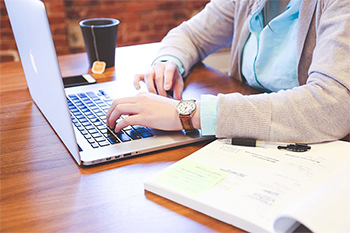Typing on Laptop in Office Representing Family Law